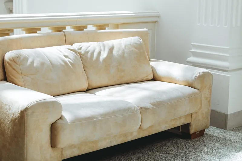 Living room with a fabric sofa by a window